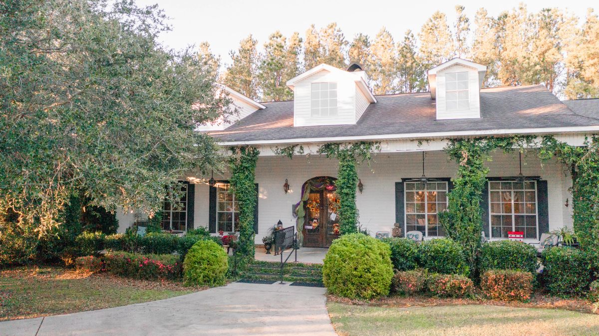 Our beautiful front porch at our fabulous garden-style home!