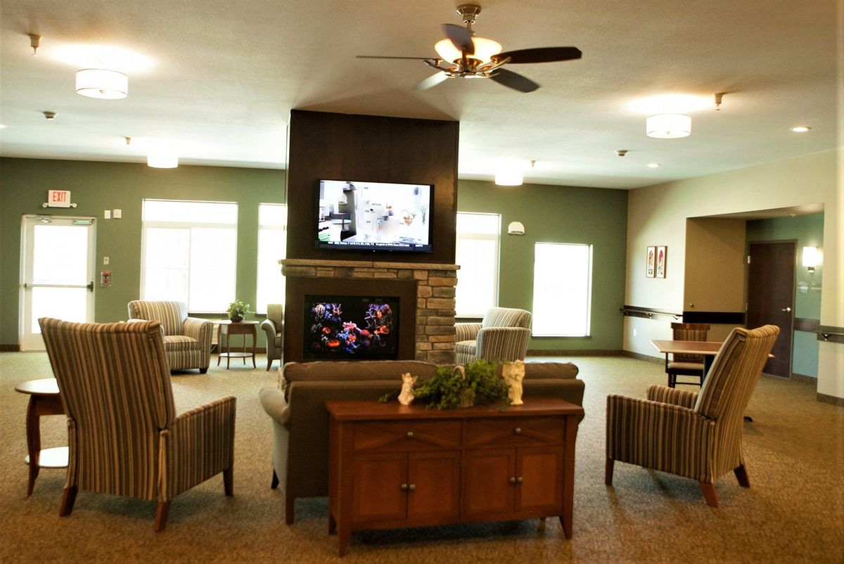 Sensory stimulation can be found within The Koselig Home through the use of sound, smell, touch, and this sitting area features our visually engaging fish tank.
