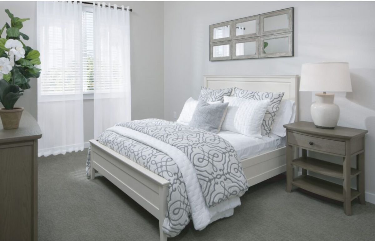 Interior design of a bedroom at The Preserve at Spring Creek senior living community.