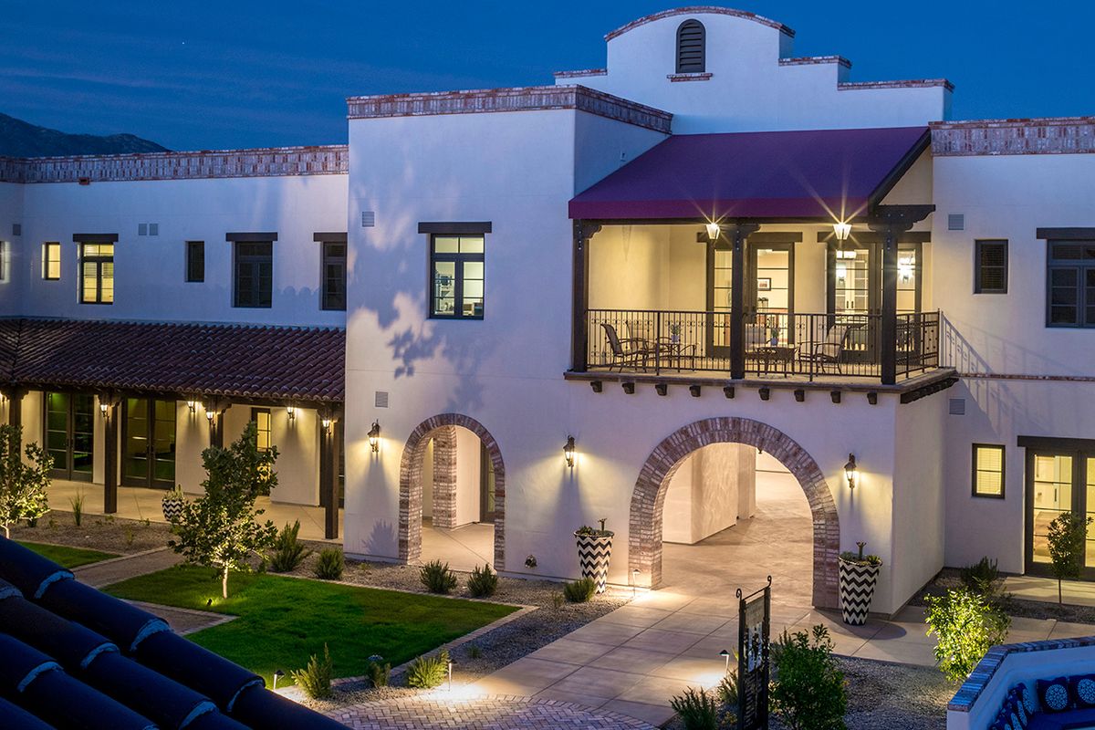 Architectural view of The Hacienda At The River senior living villa with portico in the city.