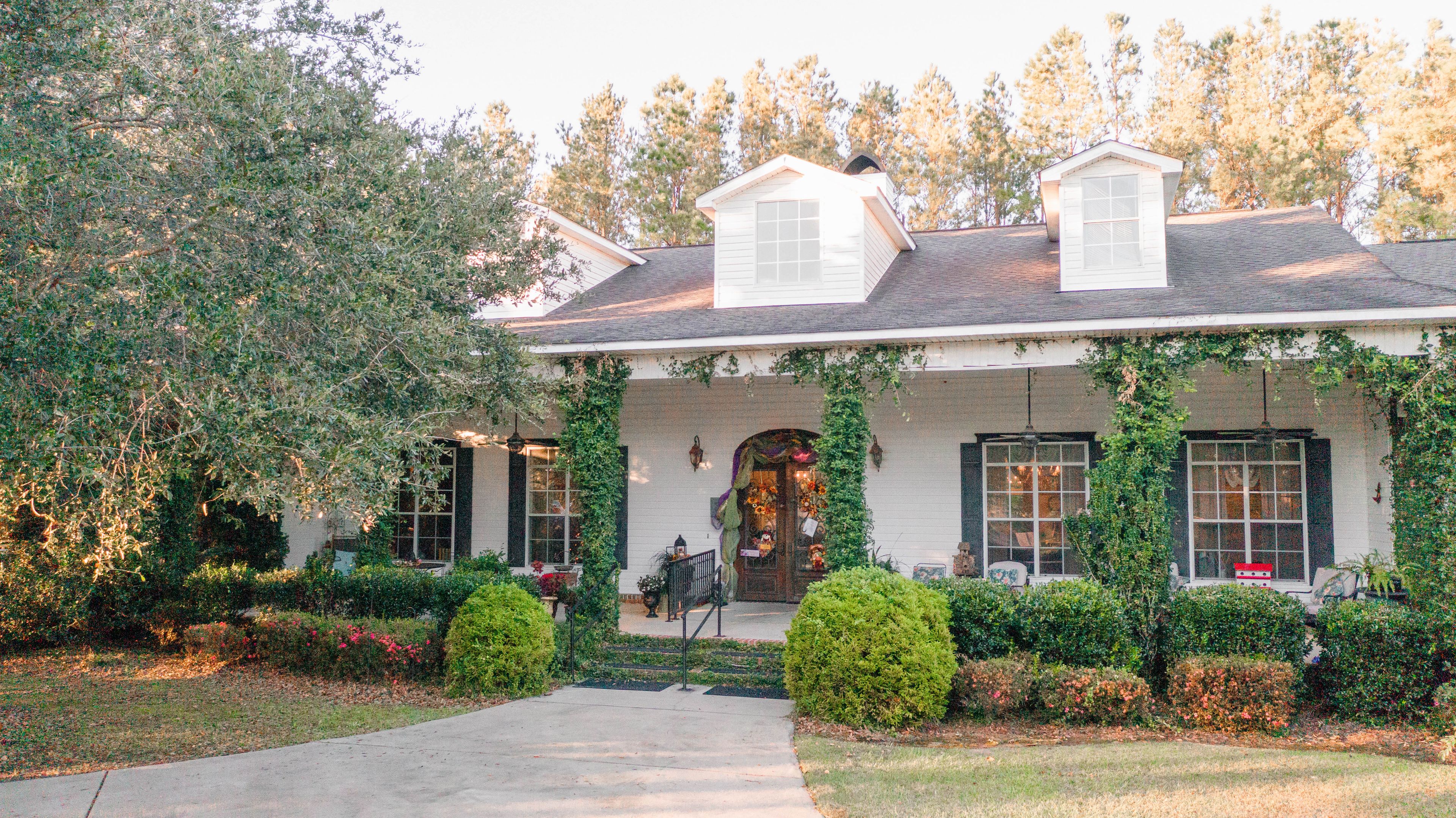 Our beautiful front porch at our fabulous garden-style home!