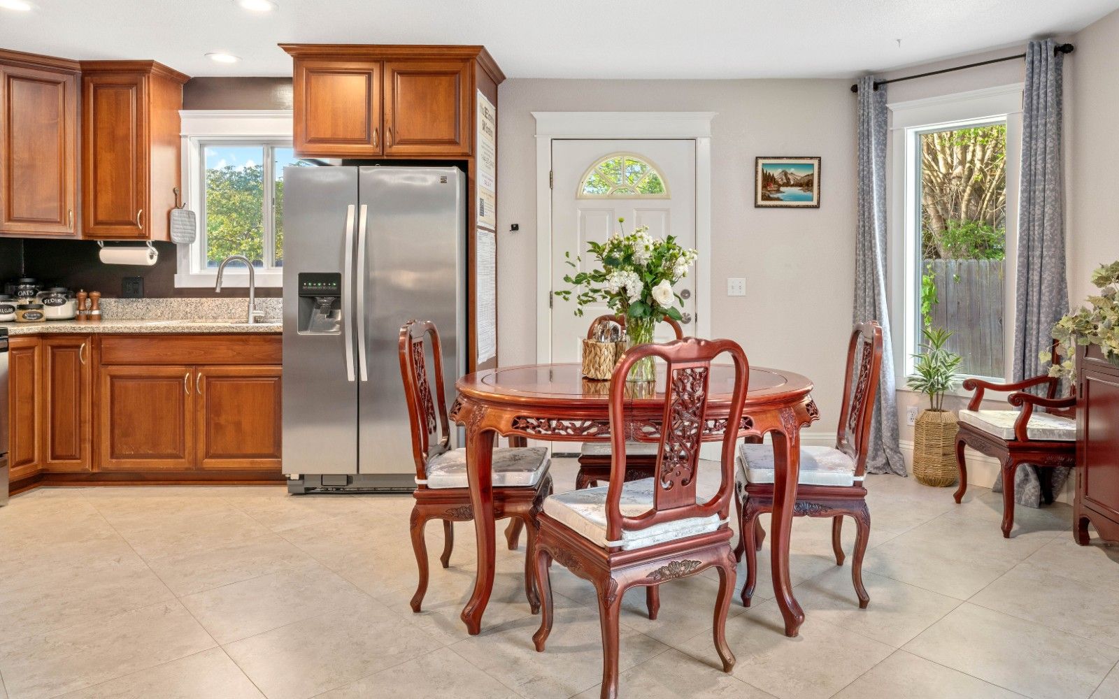 Interior view of Hollister Care Home featuring dining area, kitchen appliances, and decor.