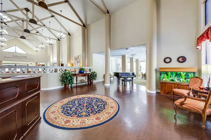 Interior view of Continental Retirement Community, featuring elegant decor, piano, and furniture.