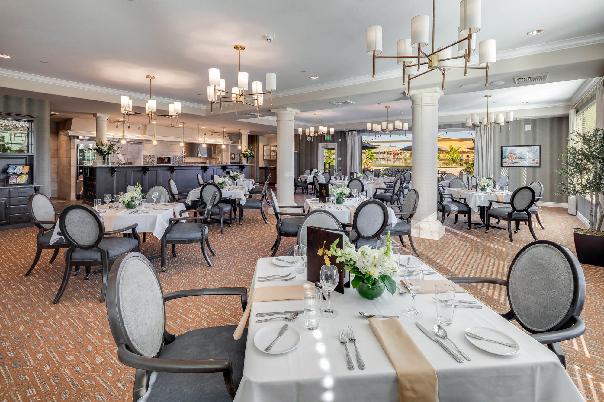 Senior living community dining room in Laurel Heights with elegant architecture and furniture.