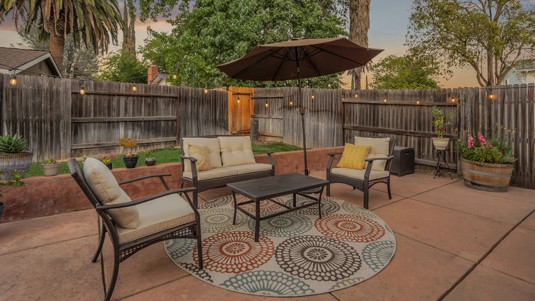 Senior living community at Jazba Care with outdoor patio, garden walkway, and cozy interior decor.