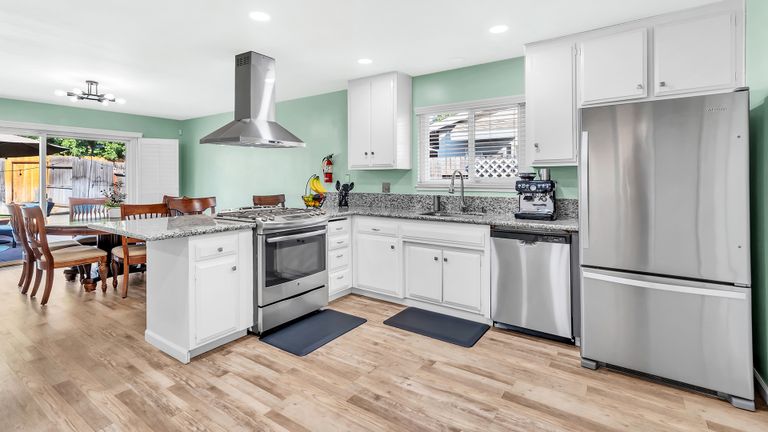 Interior of Jazba Care senior living community featuring a well-equipped kitchen with modern appliances and decor.